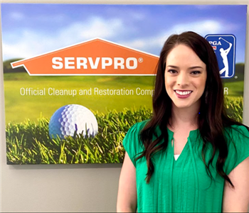 SERVPRO female marketing manager Erika is shown in front of SERVPRO logo 