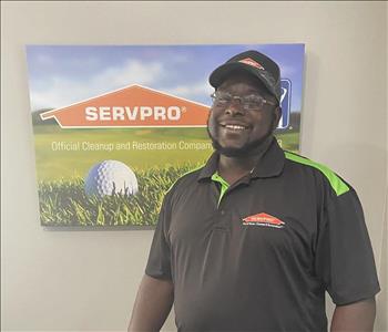 A male SERVPRO employee is shown in a black shirt with SERVPRO logo