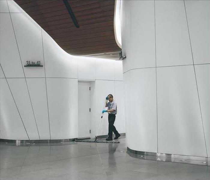 a technician is shown cleaning a large commercial space